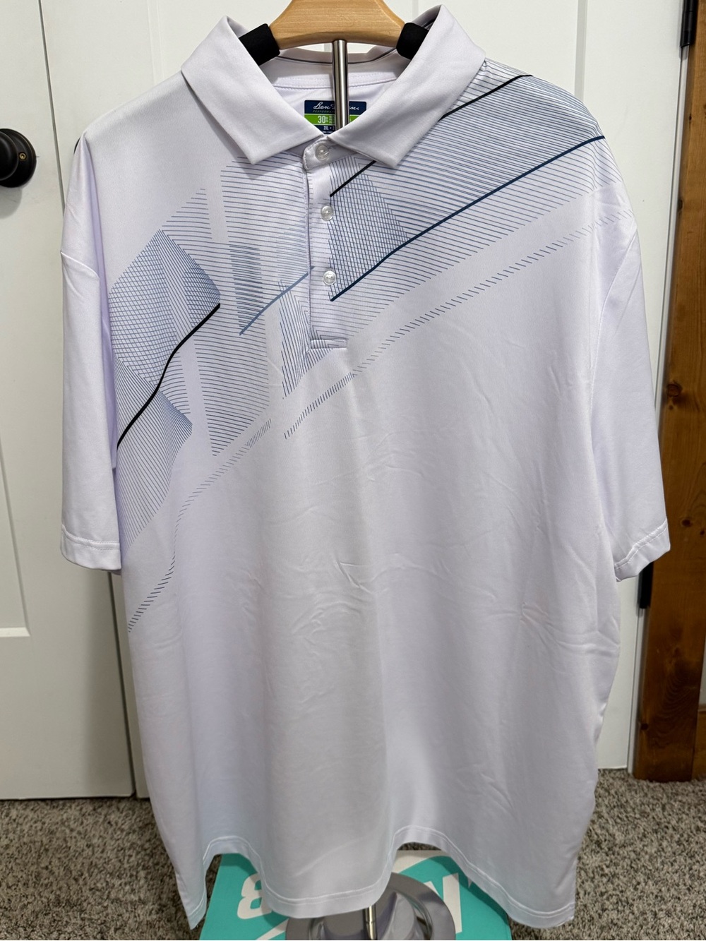 Hogan White Golf Polo with Blue and Black Linear Graphic